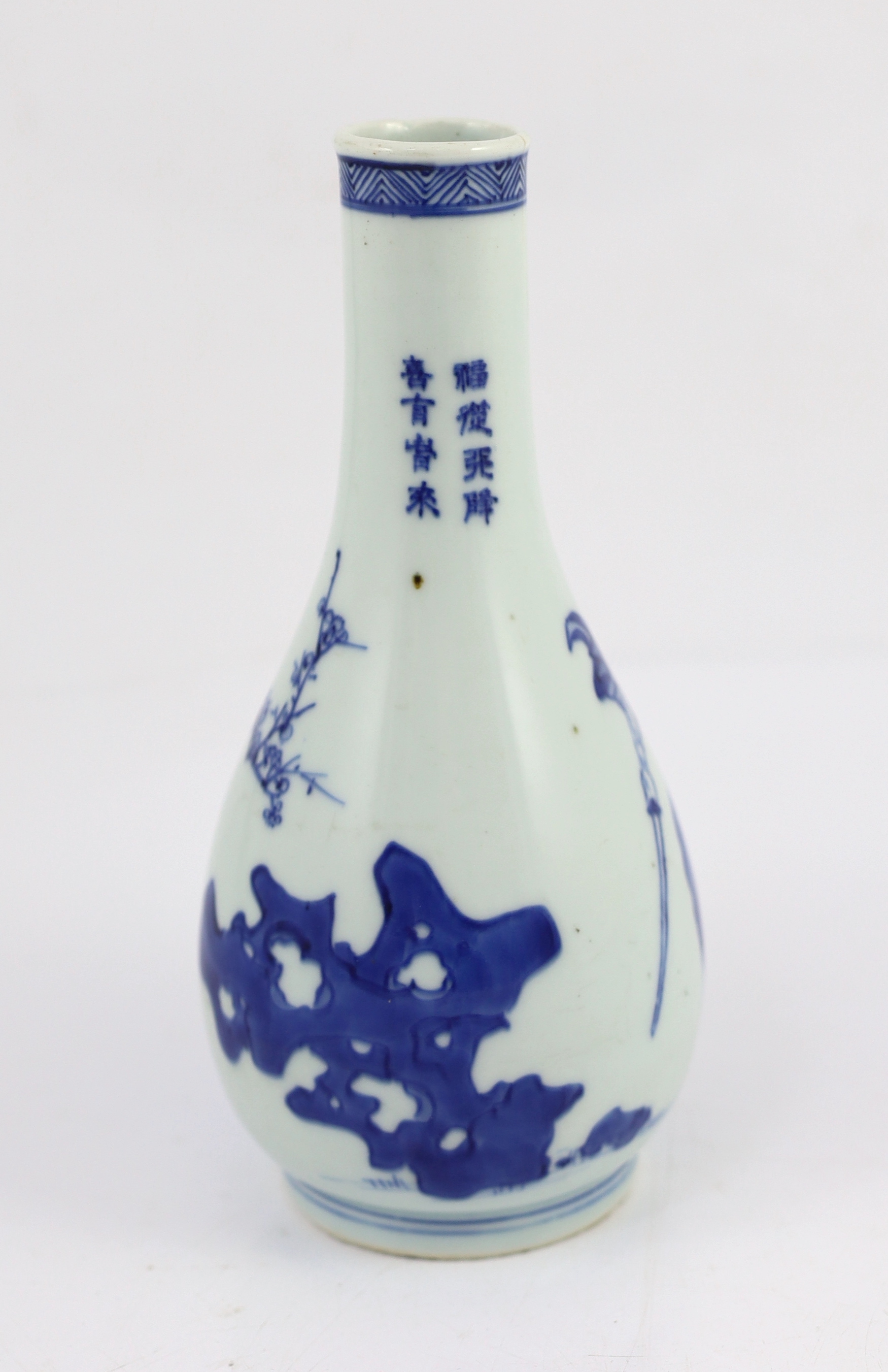 A Chinese blue and white ‘Zhong Kui’ inscribed bottle vase, early Kangxi period, hairline cracks to neck and inside edge of foot